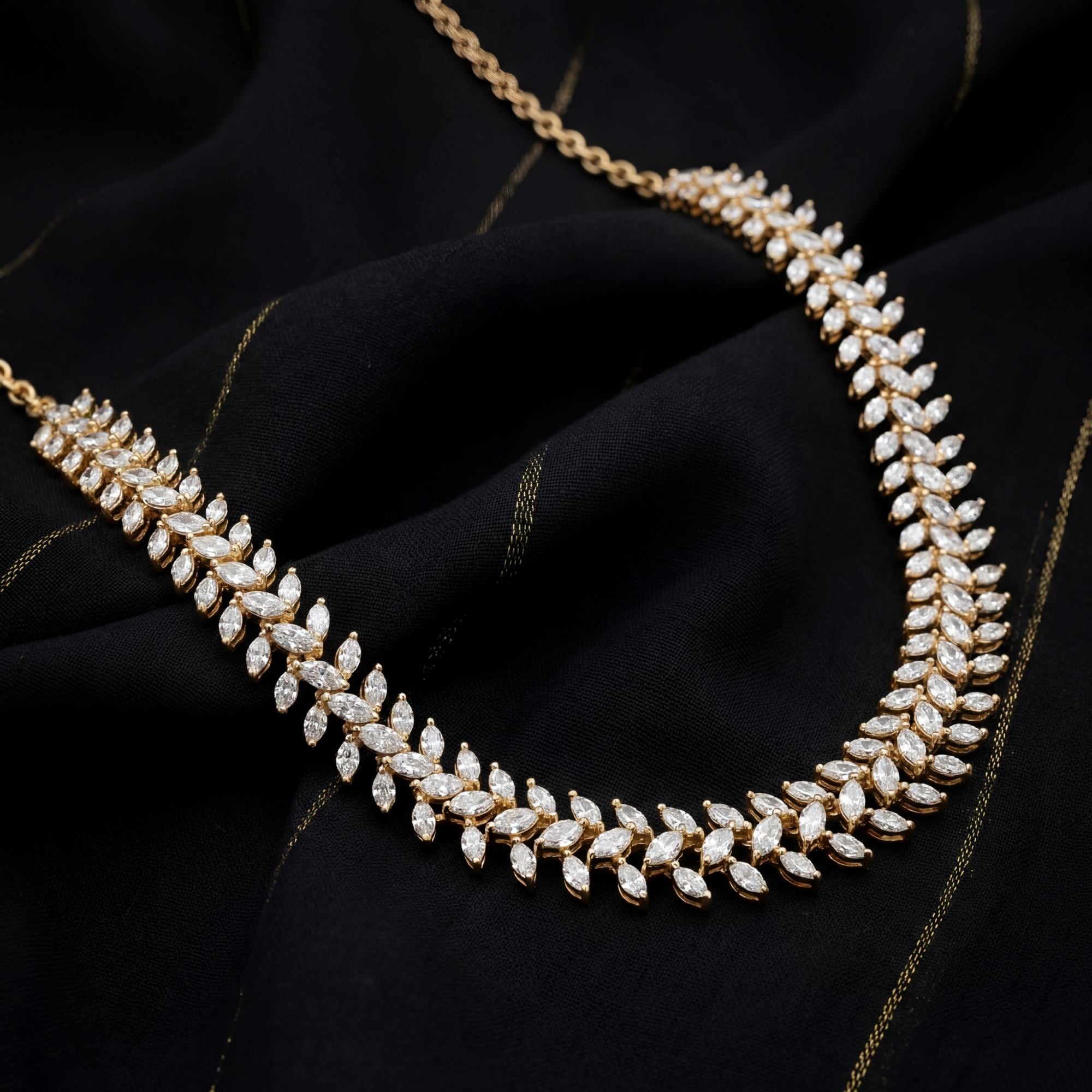 This 16 Carat MYZA necklace is a stunning display of sleek, modern geometry. While the previous pieces were about grand cascades, this design focuses on a continuous, rhythmic flow of light.