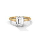 Front view of MYZA Diamonds' 1 carat emerald cut lab-grown diamond classic band ring in 18K hallmark gold. The elegant and timeless design features a brilliant lab-grown diamond, making it a sustainable and luxurious choice for engagement or wedding rings.