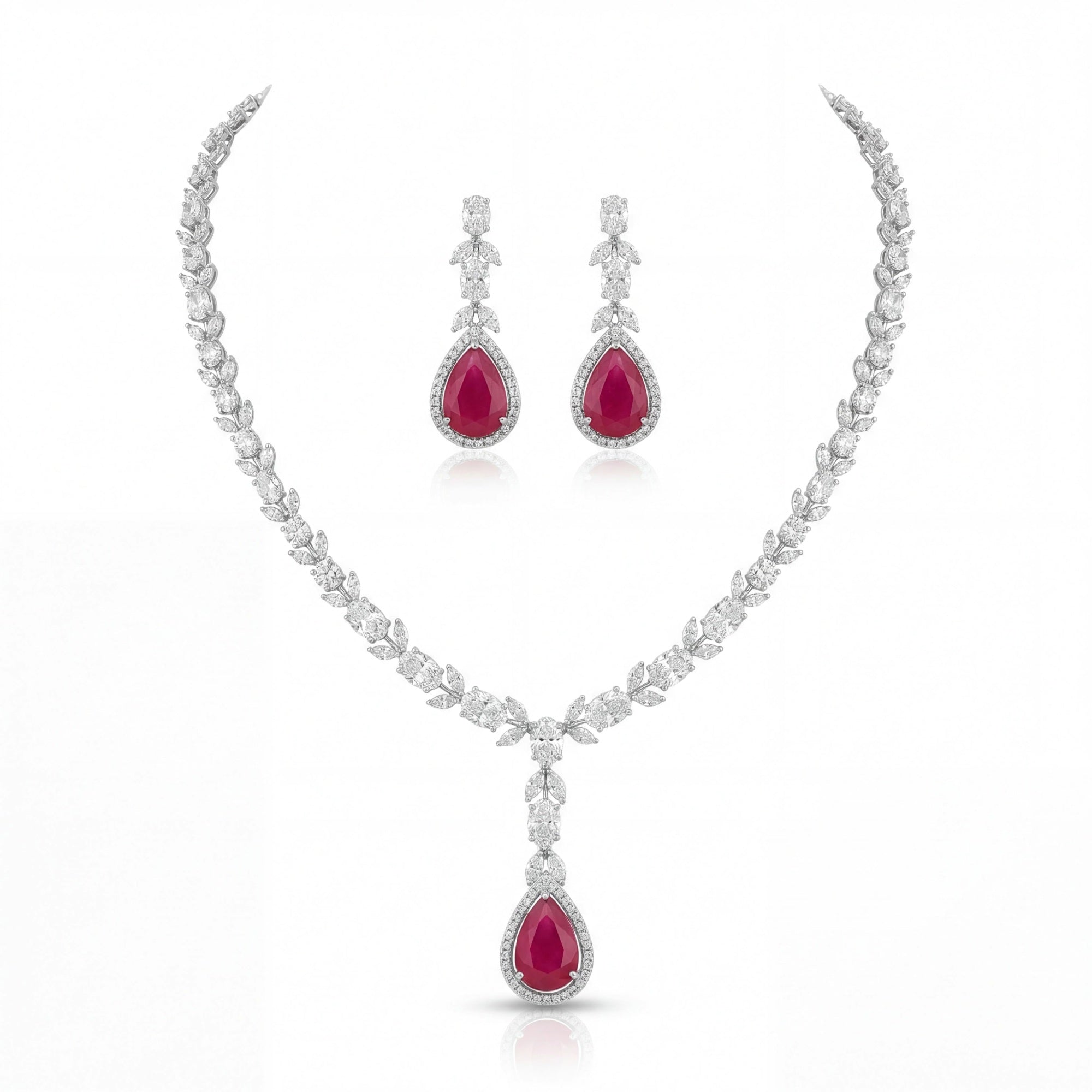 This 22 Carat MYZA set is a masterpiece of passionate color and refined geometry. By combining the deep, fiery allure of pear-cut rubies with a sophisticated mix of diamond shapes, this set creates a look of timeless majesty.