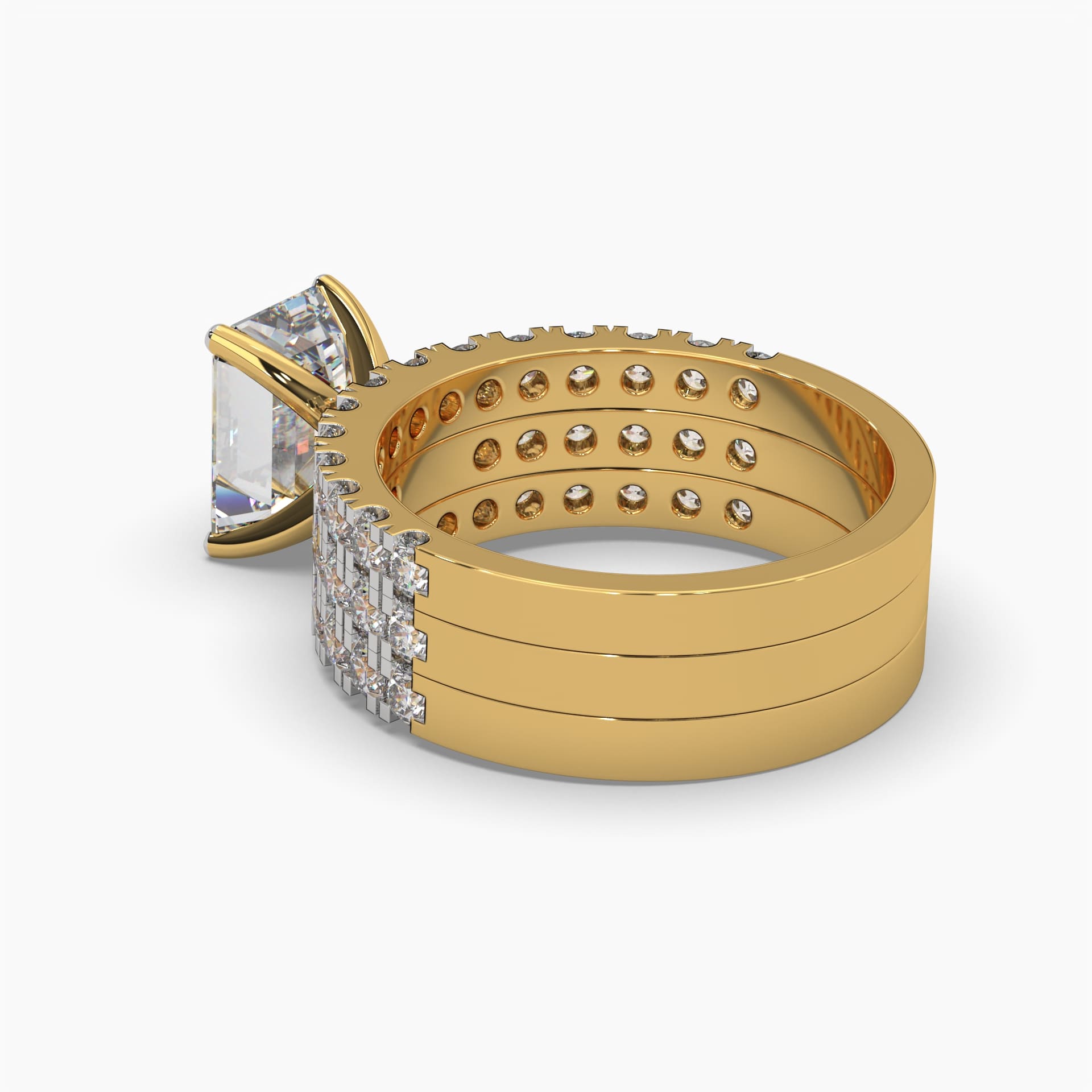 Backside angle view of MYZA Diamonds' set of three emerald cut lab-grown diamond stacking rings in 18K hallmark gold. This view highlights the meticulous craftsmanship of the bands and the secure setting of the brilliant lab-grown diamonds, showcasing the sustainable luxury of the design. Ideal for engagement or special occasions.