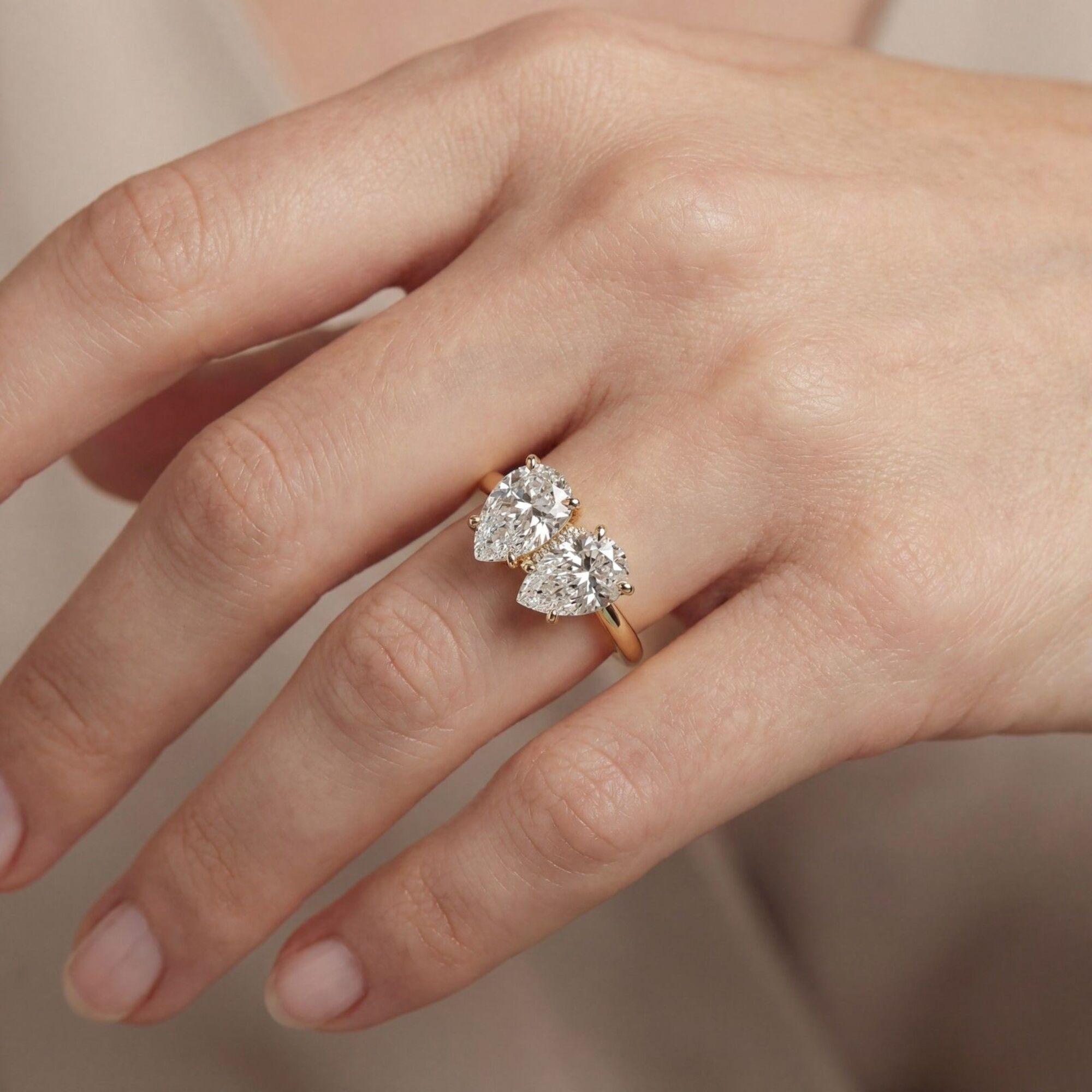 Shop MYZA's IGI Certified 2 Carat Pear Cut Lab-Grown Diamond Toi-et-Moi Ring in 18K Hallmarked Gold. Ethically grown, brilliantly crafted. Free shipping in India