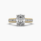 Front view of MYZA Diamonds' 2-carat oval cut lab-grown diamond ring in 18K hallmark gold. The image highlights the stunning oval cut diamond's brilliance and luxurious setting, showcasing the elegant band design, perfect for engagement or wedding rings with sustainable sophistication.