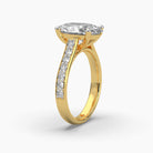 Standing side view of MYZA Diamonds' 4-carat oval cut lab-grown diamond ring in 18K hallmark gold. This angle captures the height and secure setting of the substantial 4-carat diamond, showcasing its elegance and sustainable craftsmanship, ideal for a statement engagement or wedding ring.