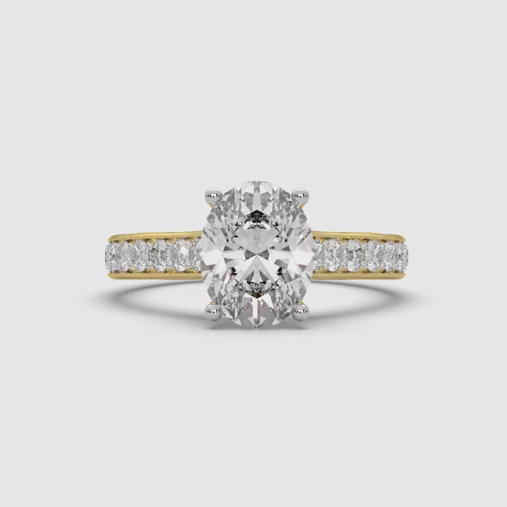360-degree video of MYZA Diamonds' 2-carat oval cut lab-grown diamond ring in 18K hallmark gold. The rotating video captures the brilliance and detailed craftsmanship of the oval cut diamond from every angle, showcasing its timeless elegance and sustainable luxury, perfect for engagement or wedding rings.