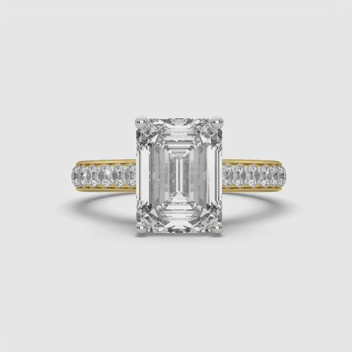 360-degree rotating view of MYZA Diamonds' 3-carat eternity band emerald cut lab-grown diamond ring in 18K hallmark gold. The video showcases the brilliance of the continuous emerald cut diamonds from all angles, highlighting the luxury and sustainable craftsmanship of the design, perfect for engagement or wedding rings.