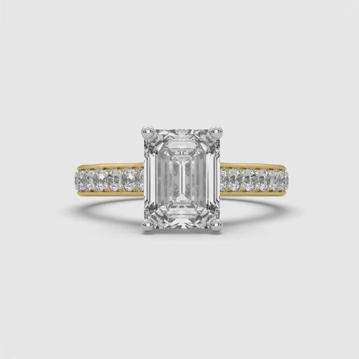 360-degree rotating video of MYZA Diamonds' 2-carat eternity band emerald cut lab-grown diamond ring in 18K hallmark gold. The video showcases the brilliance and continuous row of emerald cut diamonds from all angles, highlighting the luxurious and sustainable design, perfect for engagement or wedding bands.