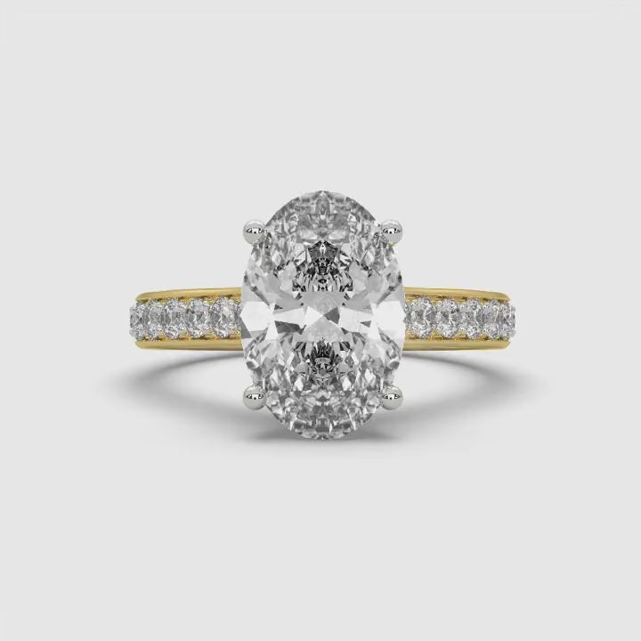 360-degree video of MYZA Diamonds' 3-carat oval cut lab-grown diamond ring in 18K hallmark gold. The rotating video captures every angle of the stunning oval cut diamond, showcasing its brilliance, elegant band, and sustainable luxury, ideal for engagement or wedding rings.