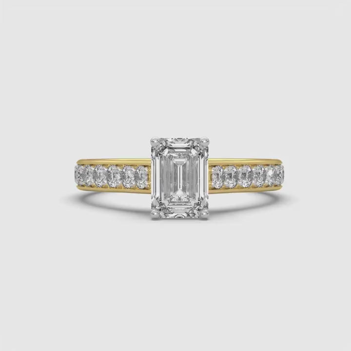 360-degree rotating video of MYZA Diamonds' eternity band emerald cut lab-grown diamond ring in 18K hallmark gold. The video captures the full brilliance and luxurious design of the continuous row of emerald cut diamonds, ideal for an elegant, sustainable engagement or wedding ring.