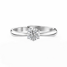Silver ring with a diamond on a white background