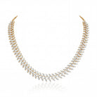 This 16 Carat MYZA necklace is a stunning display of sleek, modern geometry. While the previous pieces were about grand cascades, this design focuses on a continuous, rhythmic flow of light.