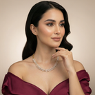 This 16 Carat MYZA necklace is a stunning display of sleek, modern geometry. While the previous pieces were about grand cascades, this design focuses on a continuous, rhythmic flow of light.