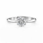 Silver ring with a diamond on a white background