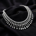 The MYZA Cascade Necklace is a feat of precision engineering and ethical brilliance. Boasting a substantial 33 carats of &nbsp;MYZA Certified diamonds, the design is centered around a "fringe" aesthetic that balances classic royalty with contemporary flair