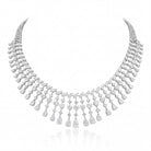 The MYZA Cascade Necklace is a feat of precision engineering and ethical brilliance. Boasting a substantial 33 carats of &nbsp;MYZA Certified diamonds, the design is centered around a "fringe" aesthetic that balances classic royalty with contemporary flair