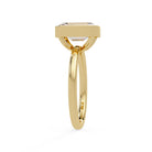 Shop MYZA's 2 carat IGI certified emerald cut lab-grown diamond bezel set engagement ring in 18K hallmarked gold. Ethical luxury, certified brilliance.