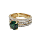 This MYZA Certified 11.2 Carats Round Cut Zambian Green Women's ring features a brilliant lab-grown Zambian emerald set in premium 18K hallmarked gold, blending the classic fire of a round brilliant cut with the rich, ethical luxury of vivid green gemstones.