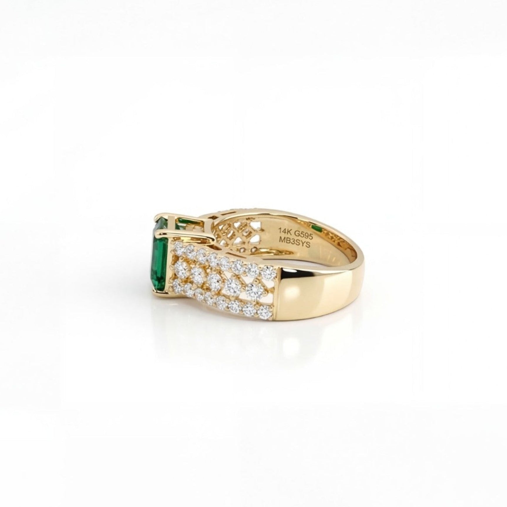 This MYZA Certified 1.5 Carats Emerald Cut Zambian Green Women's Ring  features a vivid lab-grown Zambian emerald in a 14K hallmarked gold setting, offering a sleek, sophisticated balance of classic step-cut elegance and brilliant diamond accents.