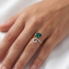 This MYZA Certified 1.7 Carats Pear Cut Zambian Women's ring showcases a vibrant, lab-grown Zambian emerald in a 14K hallmarked gold setting, combining a contemporary teardrop silhouette with a brilliant diamond halo for a sustainable luxury finish.