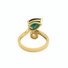 This MYZA Certified 1.7 Carats Pear Cut Zambian Women's ring showcases a vibrant, lab-grown Zambian emerald in a 14K hallmarked gold setting, combining a contemporary teardrop silhouette with a brilliant diamond halo for a sustainable luxury finish.