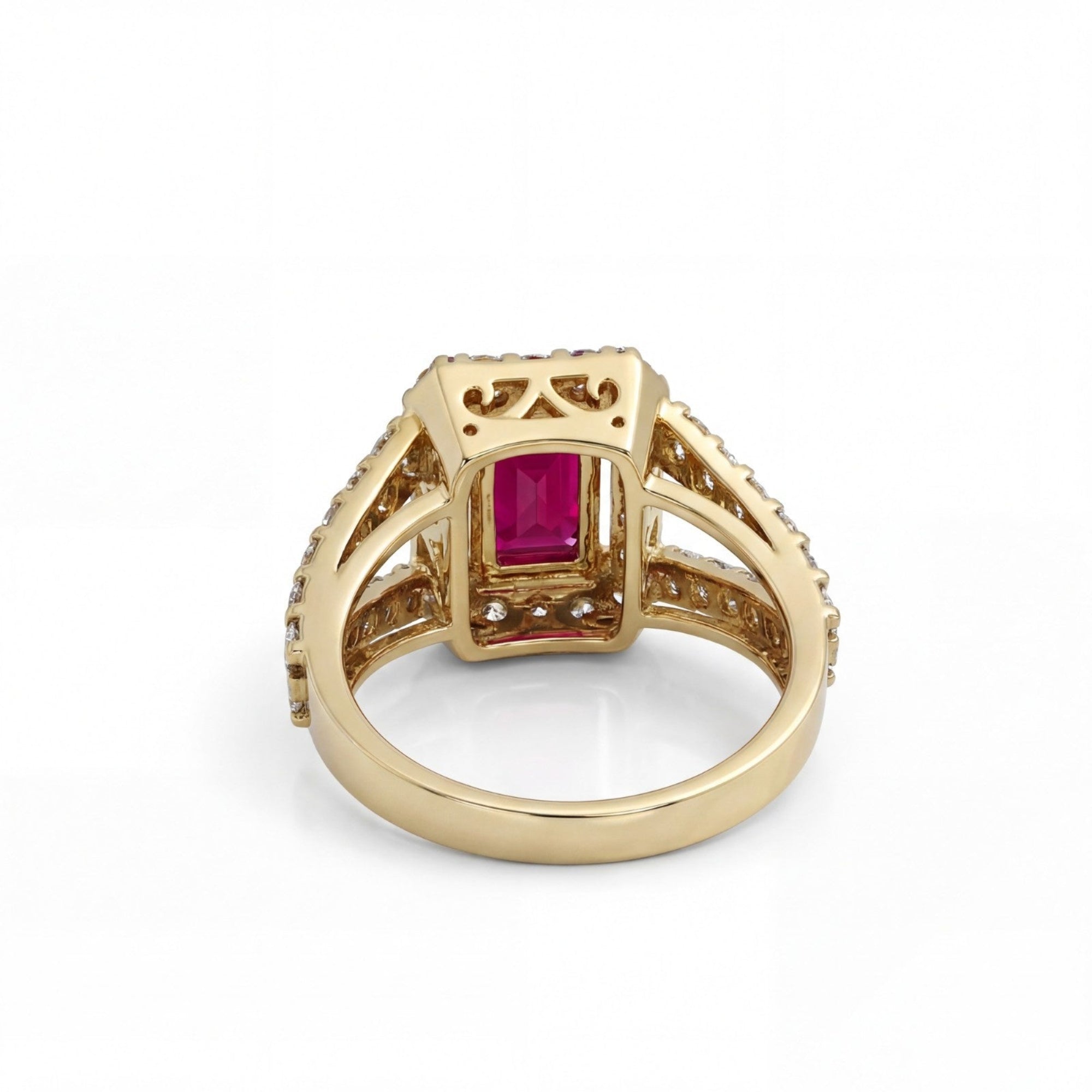 This MYZA Certified 1.8 Carats Emerald Cut Ruby Red Gemstone Women's Ring features a vivid, lab-grown ruby set in 14K hallmarked gold, combining the stone’s passionate crimson fire with a sophisticated "hall of mirrors" design and brilliant ethical diamond accents.