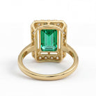 This MYZA Certified 5 Carats Emerald Cut Zambian Green Women's Ring combines a vivid, lab-grown Zambian emerald with 14K hallmarked gold and brilliant diamond accents for a bold, sustainable luxury statement.
