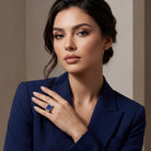 This MYZA Certified 10.12-carat Asscher-cut ring features a magnificent lab-grown Sapphire blue gemstone centerpiece encircled by a&nbsp;brilliant diamond halo and flanked by exquisite marquise diamond floral clusters, all set in premium 14K hallmarked gold