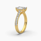 Top side view of MYZA Diamonds' eternity band emerald cut lab-grown diamond ring in 18K hallmark gold. This perspective highlights the elegant row of emerald cut diamonds set across the band, showcasing the brilliant shine and timeless design, perfect for engagement or wedding rings.