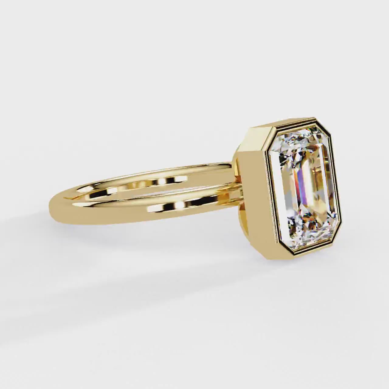 Shop MYZA's 2 carat IGI certified emerald cut lab-grown diamond bezel set engagement ring in 18K hallmarked gold. Ethical luxury, certified brilliance.