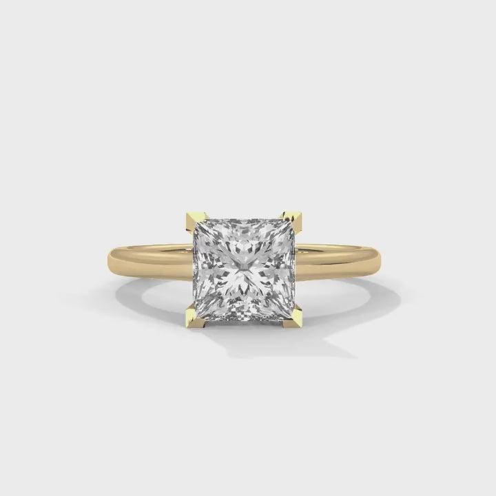 all-groups 360-degree view of a MYZA classic princess cut diamond ring with a yellow gold band. This video showcases the luxurious lab-grown diamond from all angles, highlighting its elegance and timeless design.