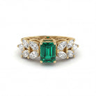 This MYZA Certified 1 Carats Emerald Cut Zambian Green Women's ring features a vivid, lab-grown Zambian emerald set in 14K hallmarked gold, offering a sleek, "hall of mirrors" aesthetic paired with brilliant, sustainable diamond accents.